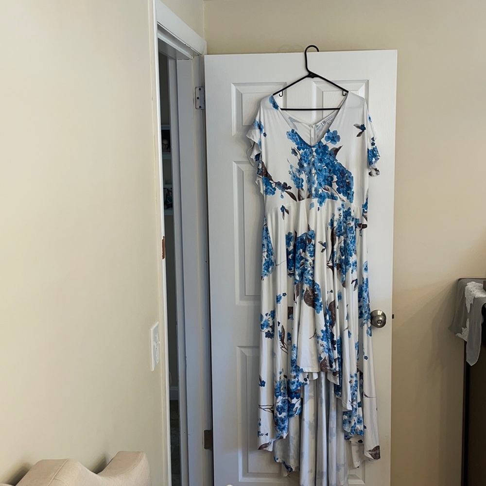 Women’s hi-lo white dress with blue flowers.